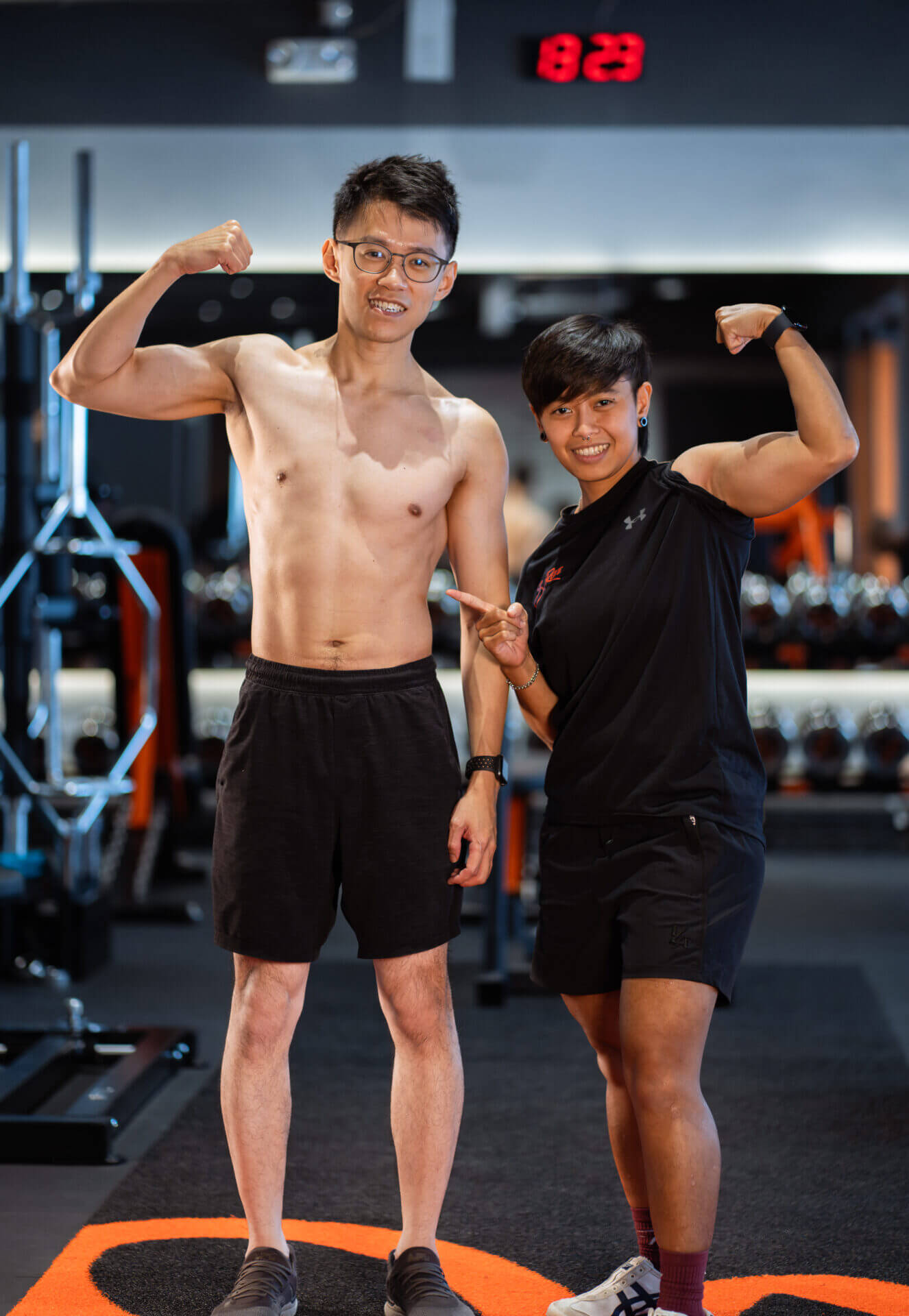 Daniel | Best Personal Trainer Fitness Gym In Singapore | Surge PT: Strength & Results Daniel Male Personal Training Transformation With Female Personal Trainer Charmaine in Singapore Flexing
